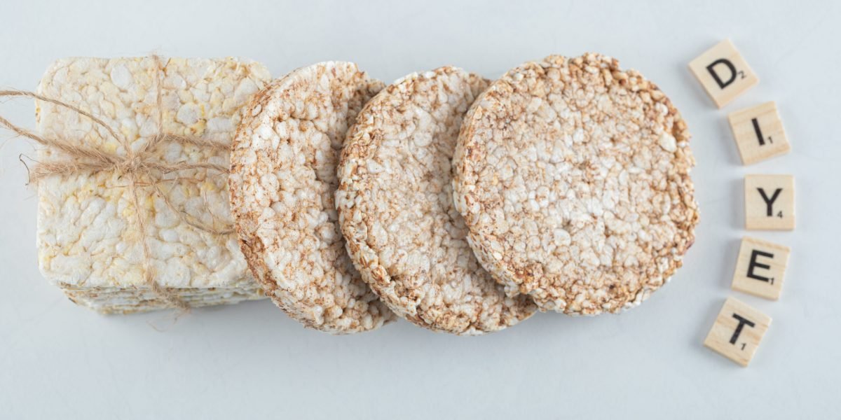 Two types of puffed crispbread tied with rope and wooden letters. High quality photo