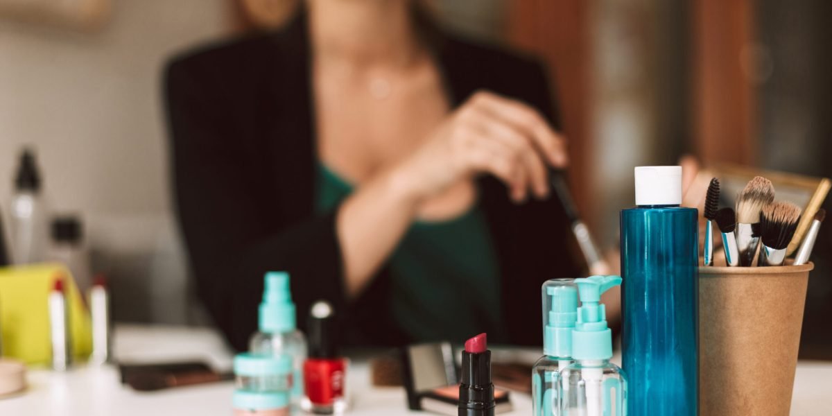 Close up variety of cosmetic products on desk