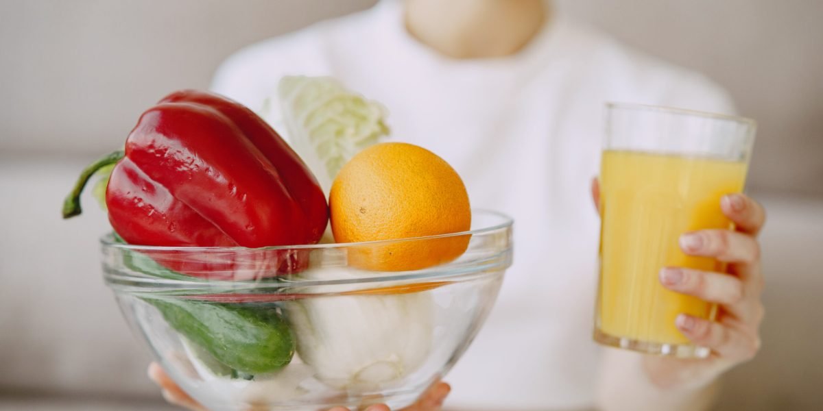 Woman with fruits. Nutritionist shoots a blog.